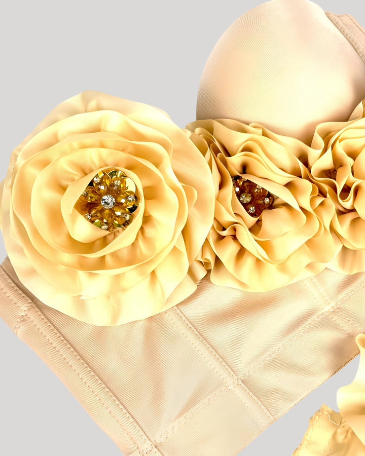 Front view of cream corset top featuring oversized rosettes