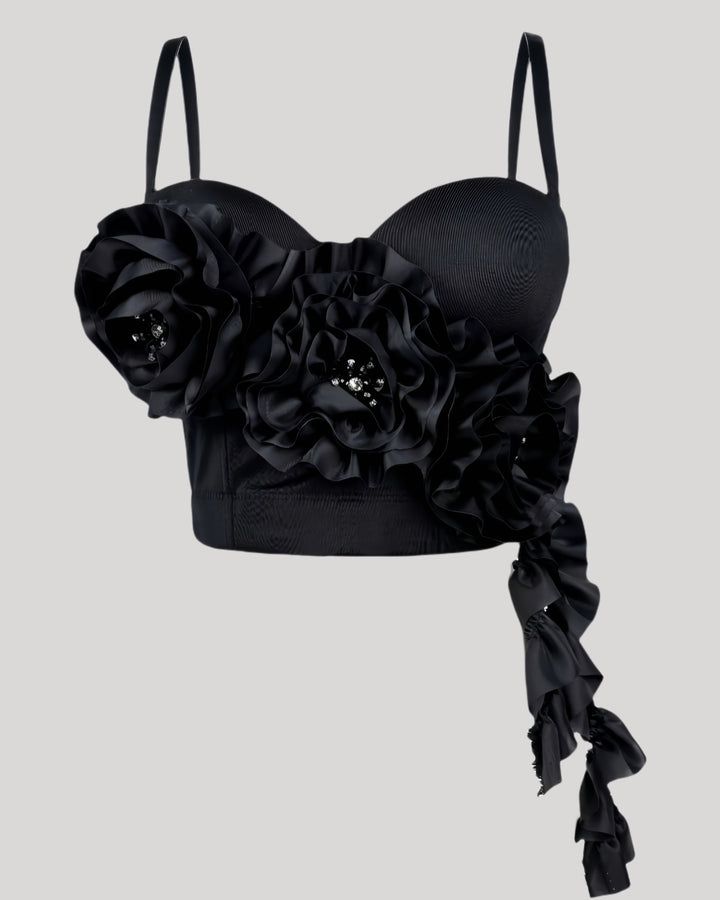 Front view of black corset top with jeweled floral accents