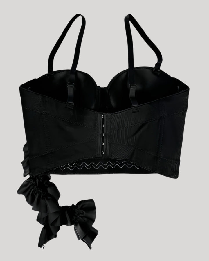 Back view of black corset showing hook-and-eye closure