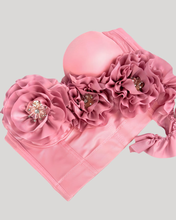 Close-up of pink rosette showing crystal-like jeweled center