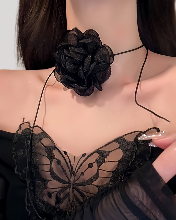 Model wearing black mesh rose choker with long satin ties