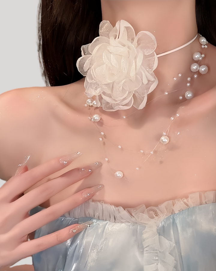 White rose mesh choker paired with pearl necklace on model