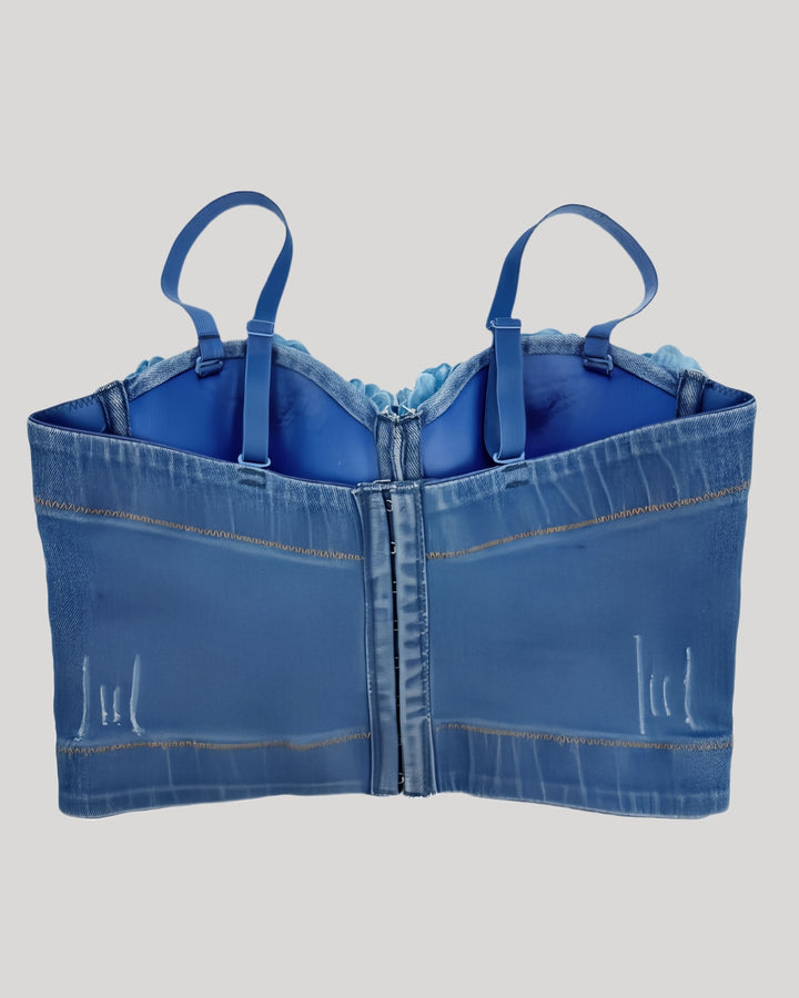 Back view of blue denim corset with adjustable straps