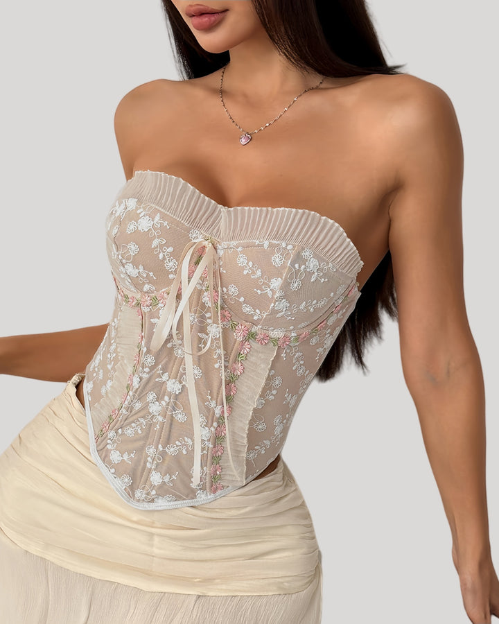 Strapless embroidered bustier top with pleated mesh and ribbon tie, front view