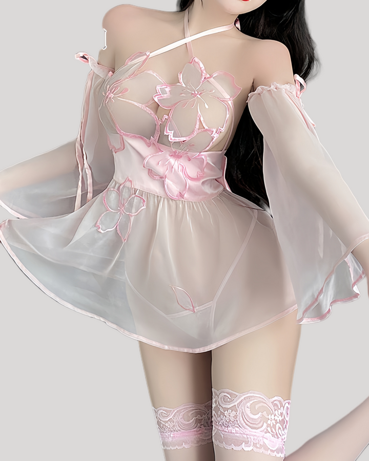 Model wearing pink sheer fantasy babydoll lingerie with floral embroidery and bell sleeves, front view