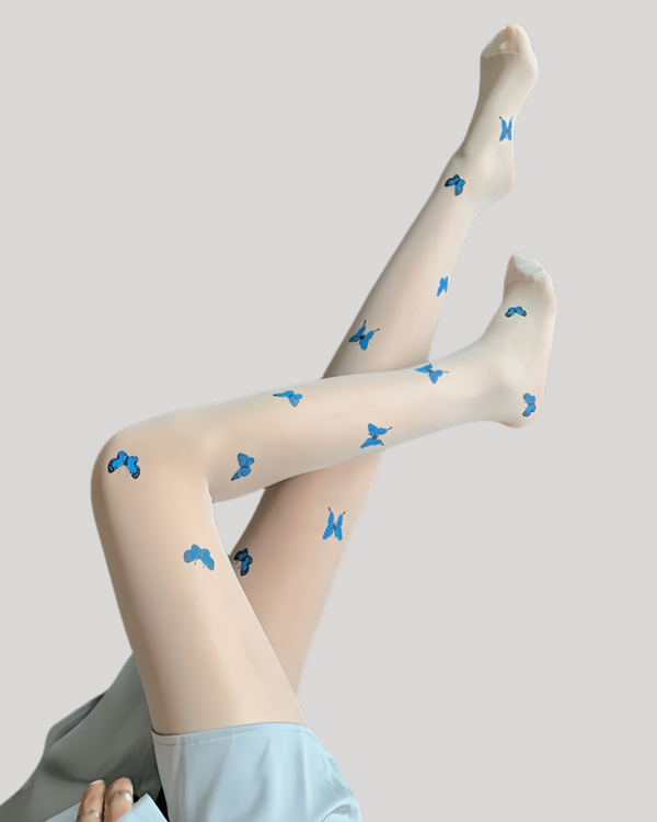 Nude tights featuring scattered blue butterfly