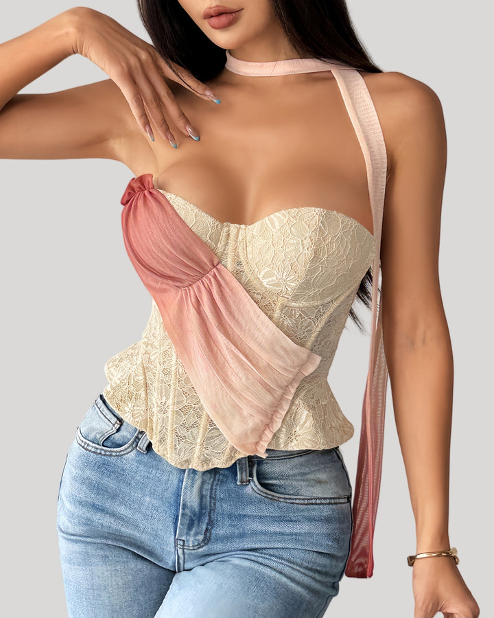 Model wearing blush drape lace bustier with ombré sash front view