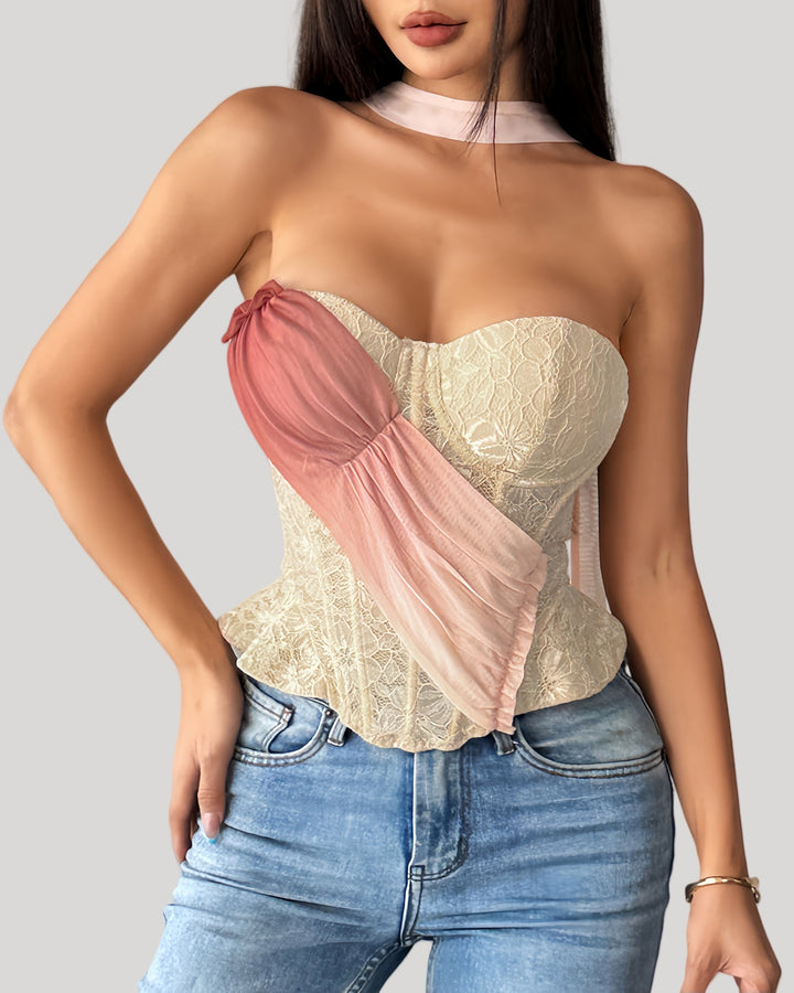 Model wearing blush drape lace bustier with ombré sash front view
