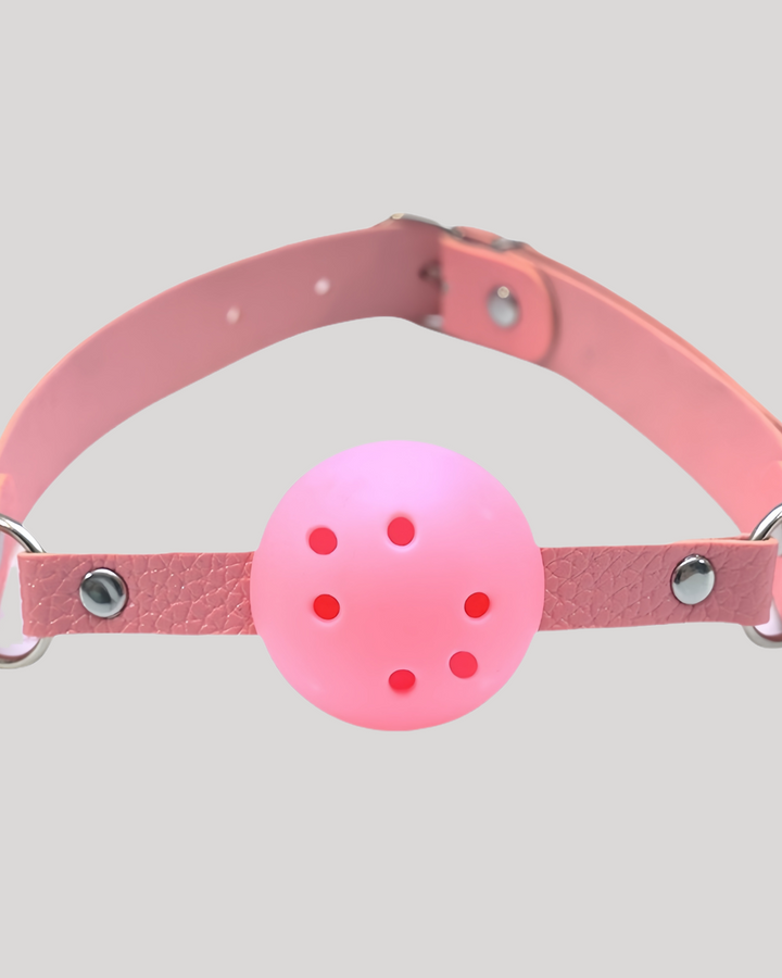 Pink silicone ball gag with ventilation holes and silver rivets