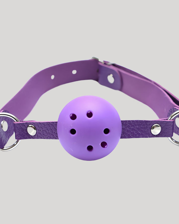 Purple silicone vented ball gag with faux leather strap