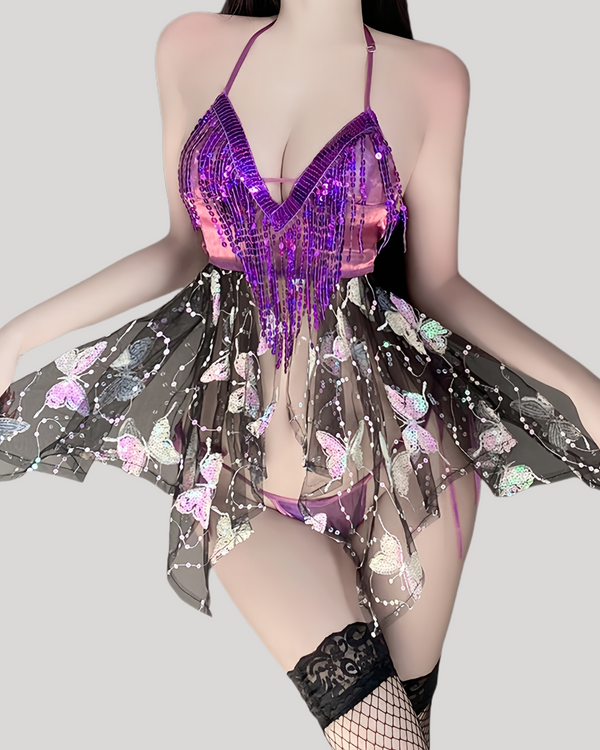 Front view of model wearing butterfly sequin halter sheer dress
