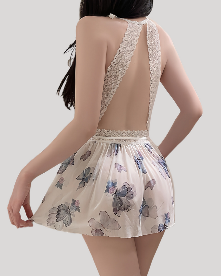 Back view of open back butterfly print babydoll with lace straps