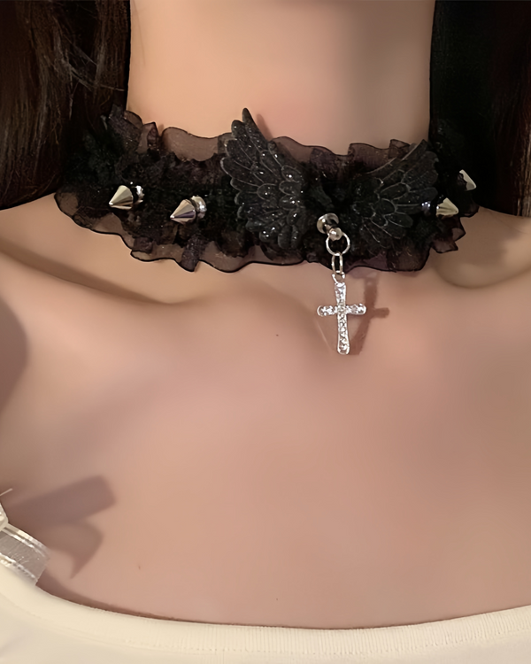 Close-up of model in black version of angel choker featuring gothic wings and studded lace