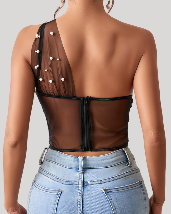 Back view of sheer one-shoulder bustier with zipper closure