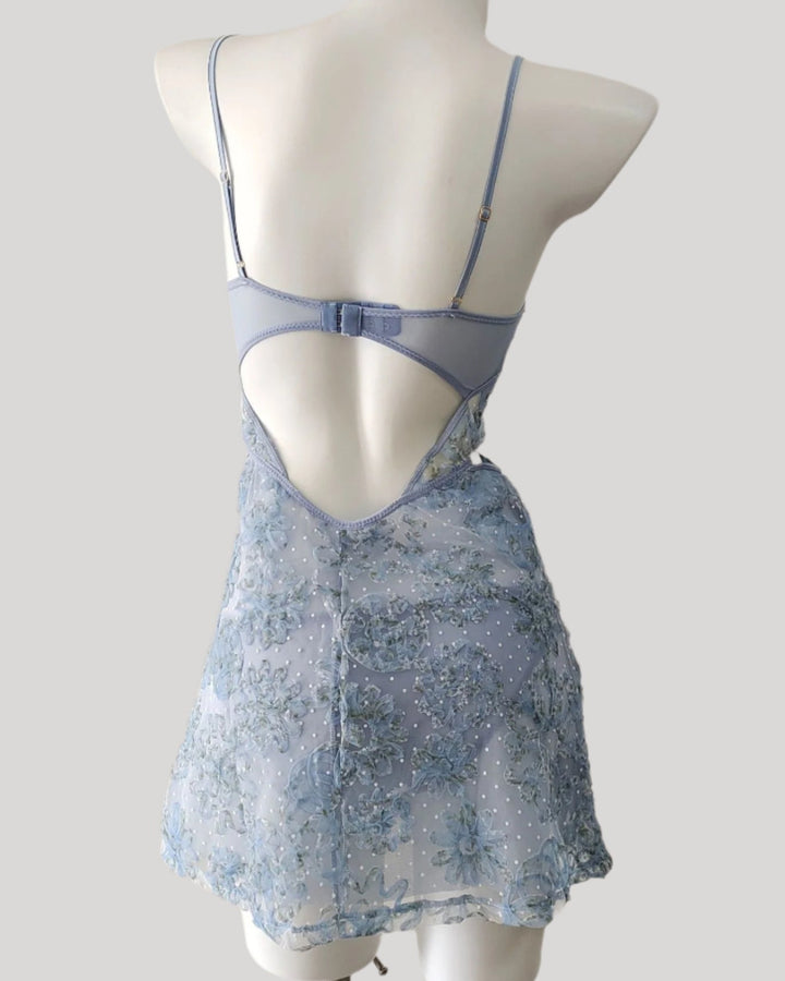 Back views of light blue embroidered babydoll nightdress with lace-up waist and floral details.