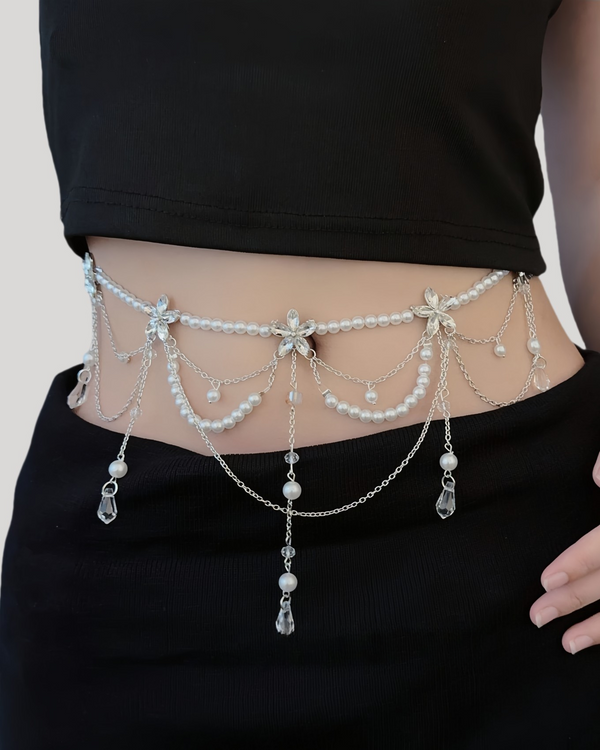 Waist chain with pearls, silver chains, and crystal teardrops worn with black outfit