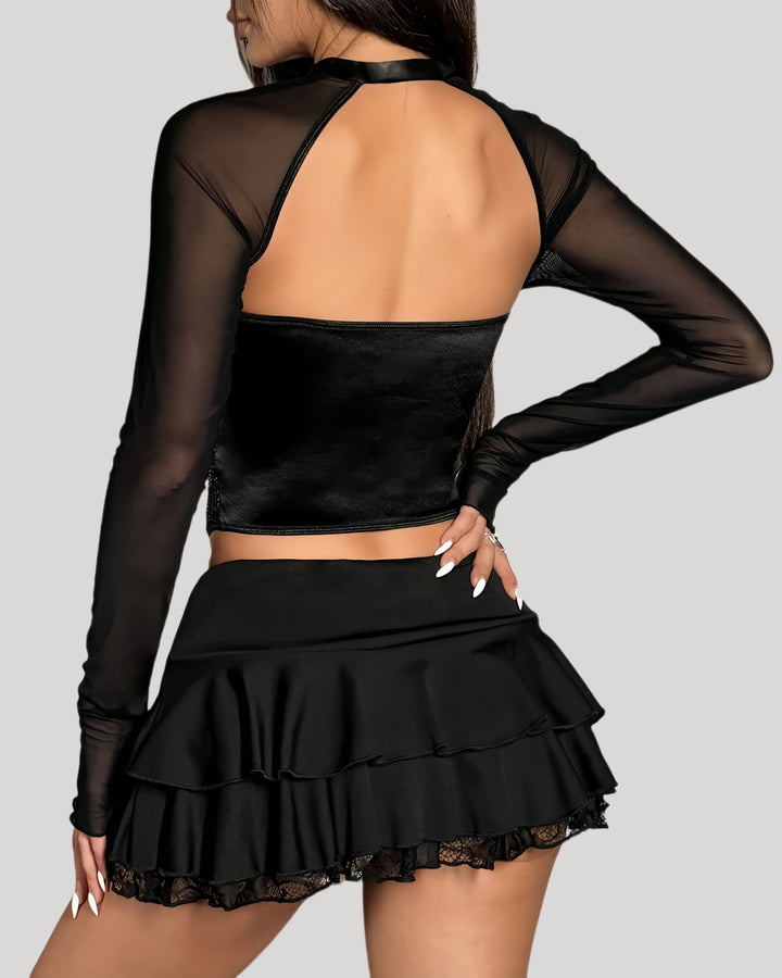 Back view of glitter sequin corset set with mesh arm sleeves and layered mini skirt