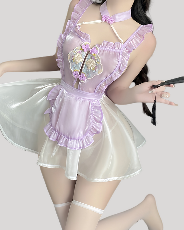Model wearing lavender embroidered fantasy dress with sheer skirt and halter neck