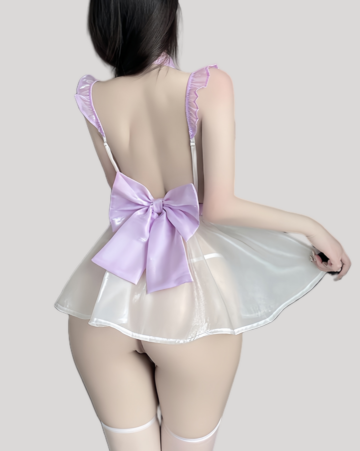 Back view of the fantasy dress showing large satin bow and translucent skirt