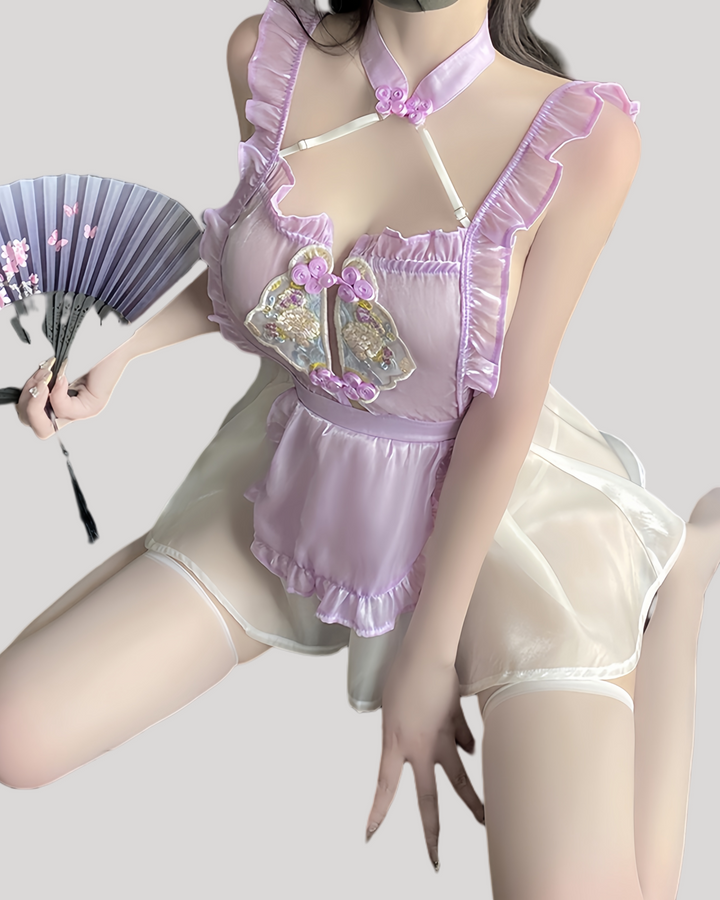 Model wearing lavender embroidered fantasy dress with sheer skirt and halter neck