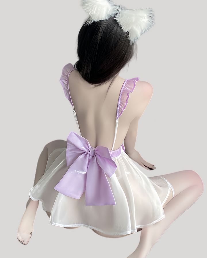 Back view of the fantasy dress showing large satin bow and translucent skirt