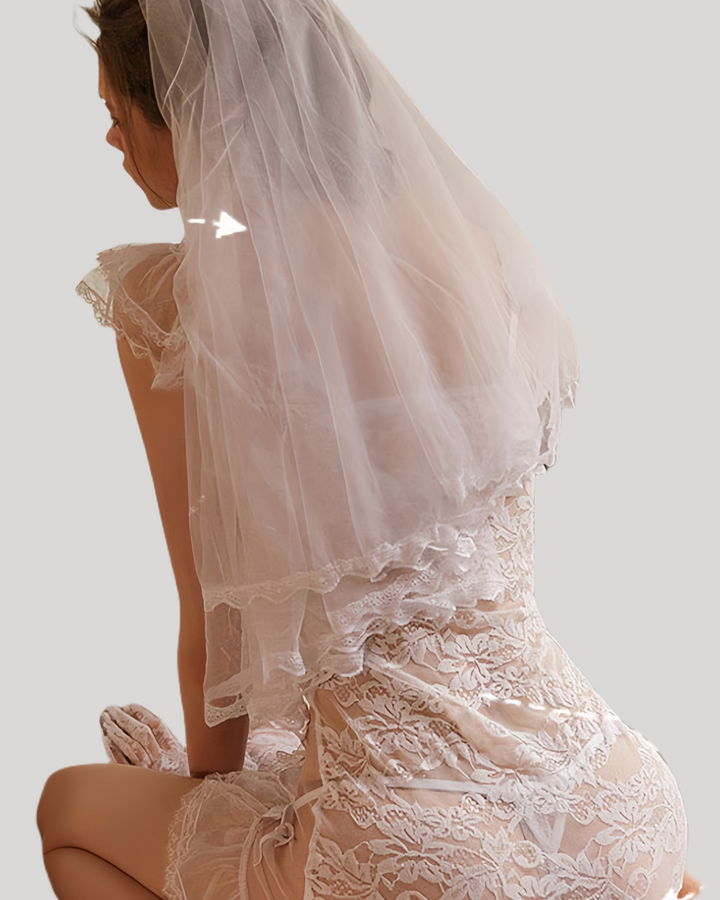 Back view of white lace chemise with layered tulle veil