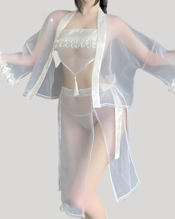 Model wearing sheer fantasy kimono lingerie set with ruffle bandeau and tassel waist strap