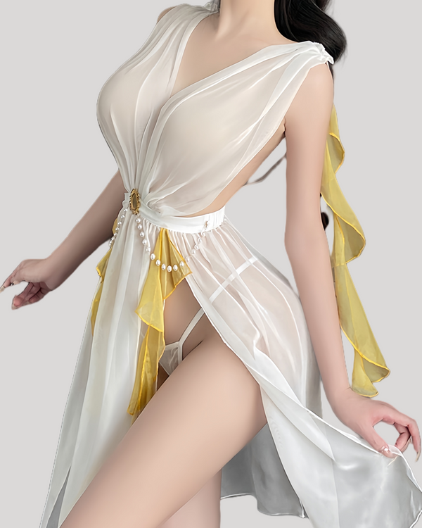 Model in white and gold sheer fairy dress with deep V and flowing panels