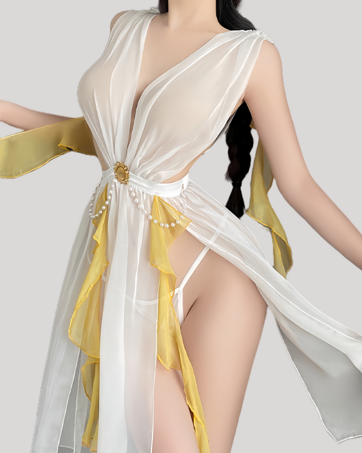 Model in white and gold sheer fairy dress with deep V and flowing panels