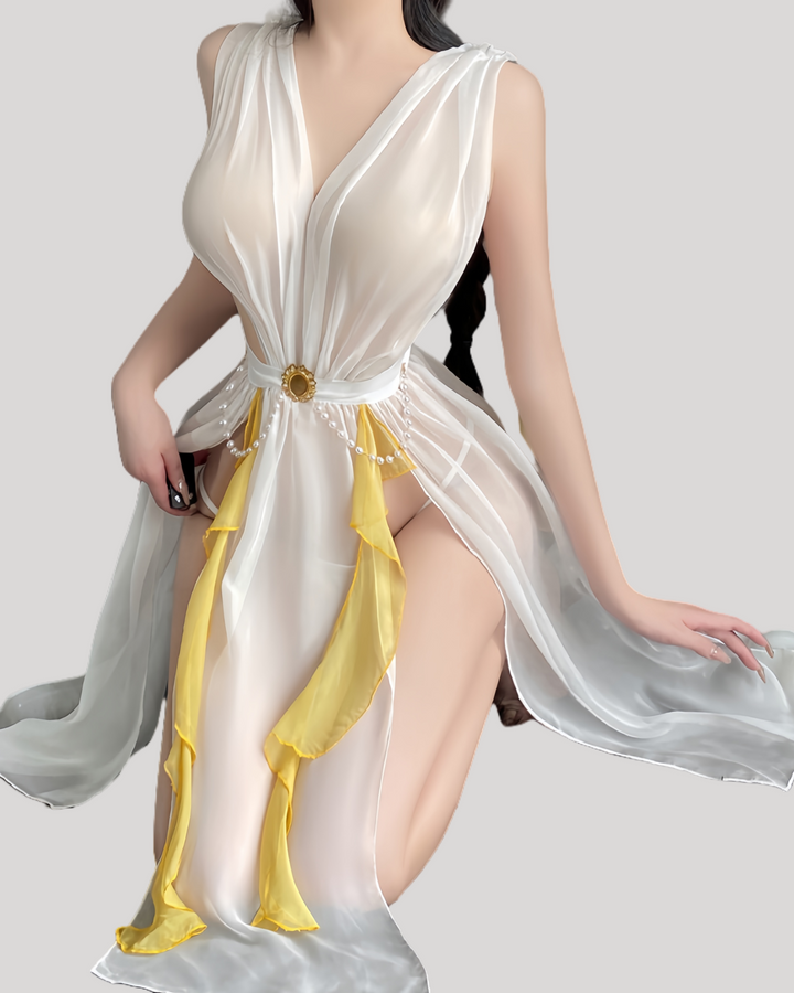 Model in white and gold sheer fairy dress with deep V and flowing panels