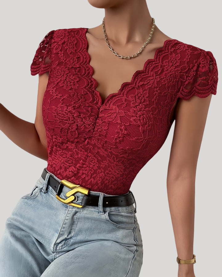 Wine red lace bodysuit highlighting deep V neckline and fitted shape