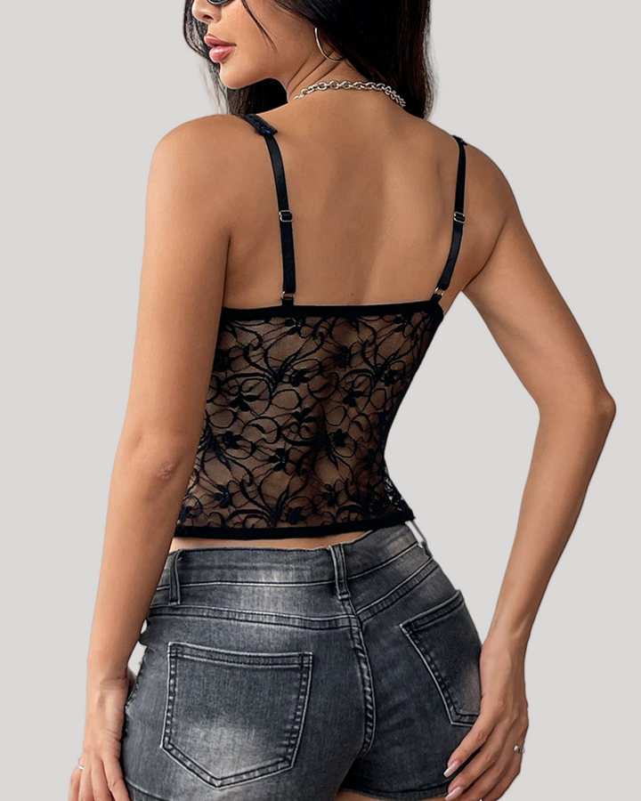 Black floral lace underwire bustier top with blue underlay back view on model wearing denim shorts