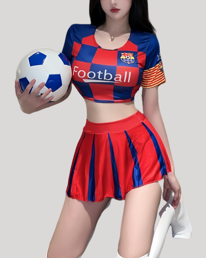 Model wearing red and blue football-themed crop top and pleated mini skirt