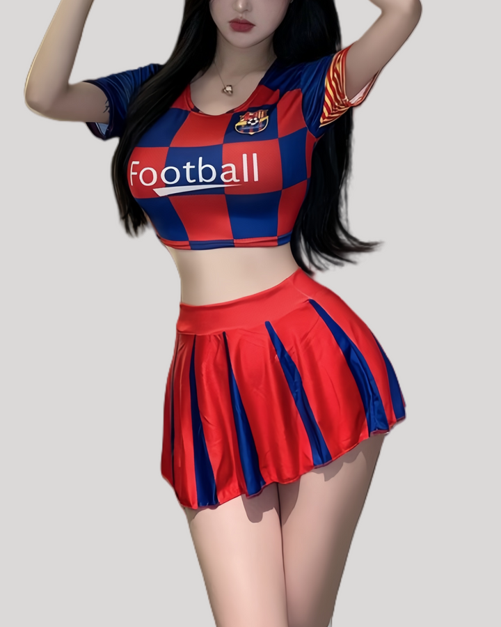 Model wearing red and blue football-themed crop top and pleated mini skirt