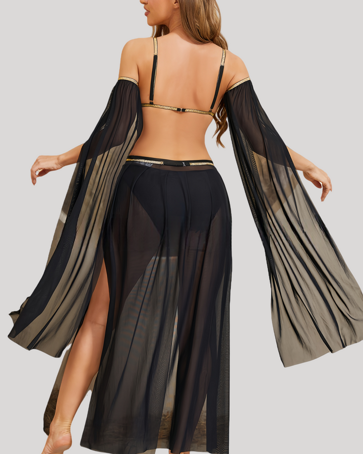 Back of black belly dance costume on mannequin, featuring adjustable bra straps, open back design, and wraparound coin belt.
