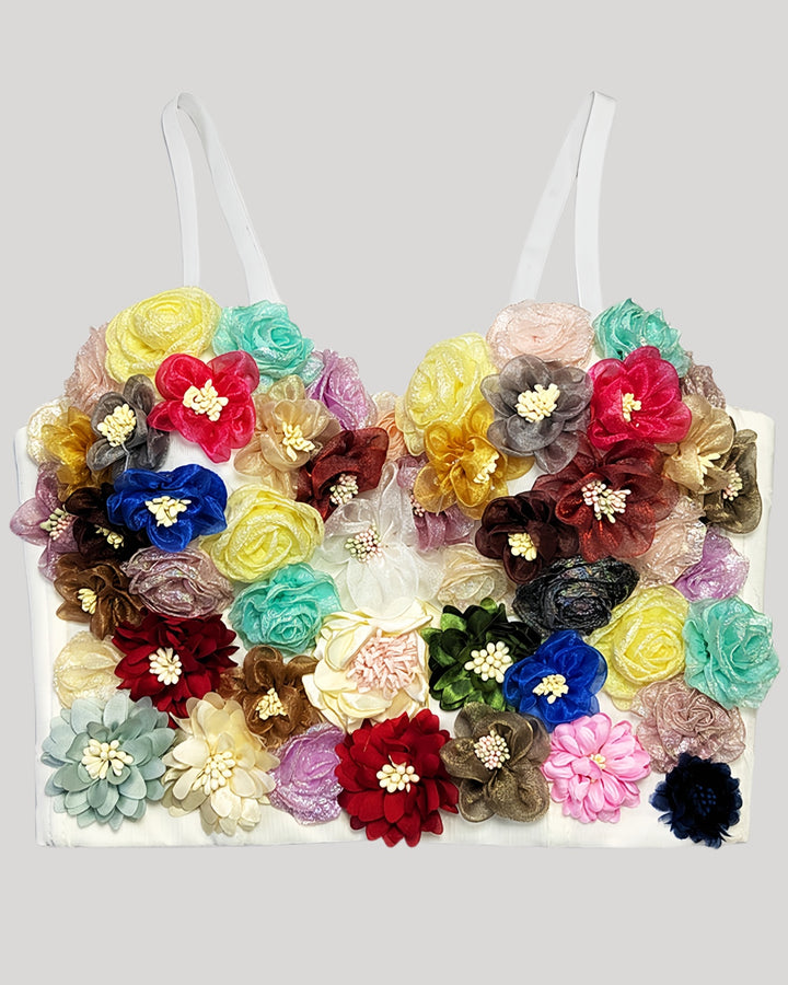 White corset featuring uniquely arranged handmade fabric flowers