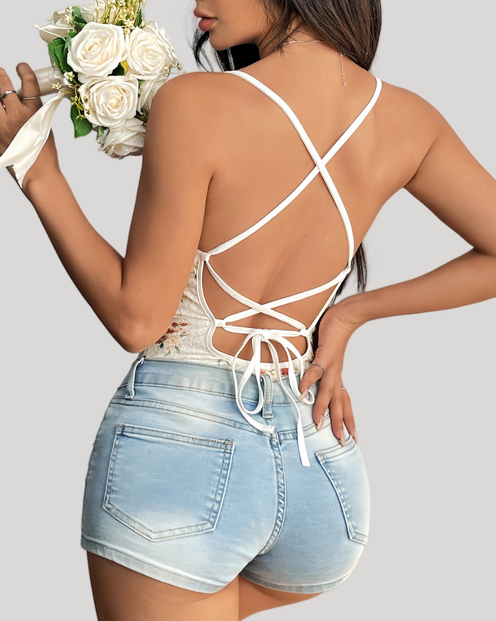 Back view of lace-up strappy bodysuit with crisscross open design