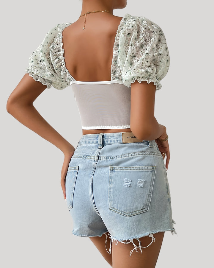 Back view of sheer mesh back floral bustier top