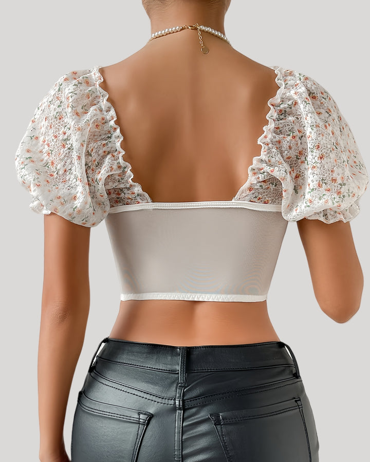 Back view of sheer mesh back floral bustier top