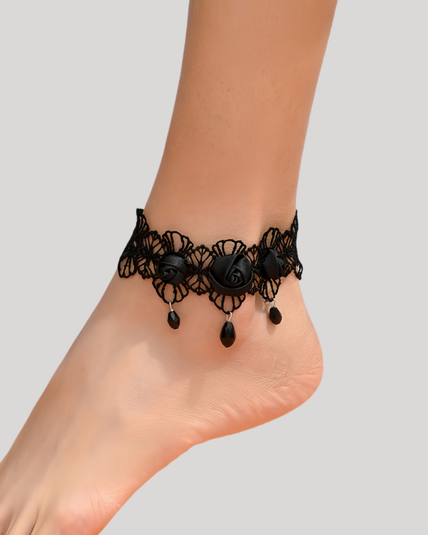 Black lace anklet with rose and bead details worn on foot