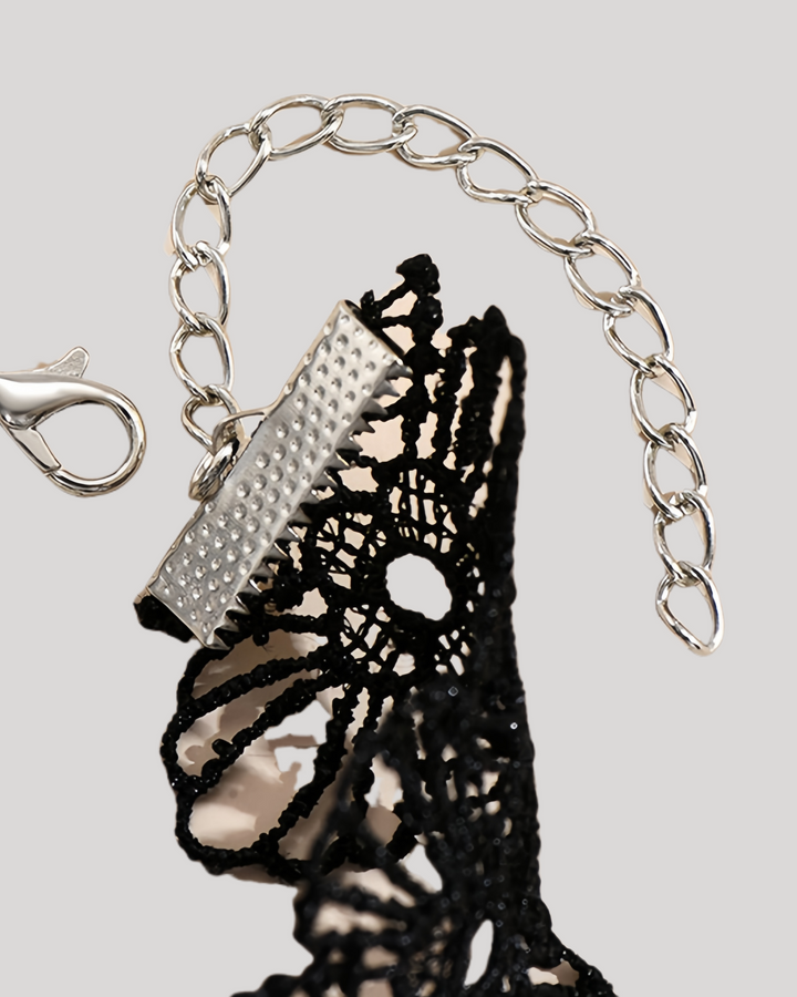Detailed shot of silver clasp and adjustable chain
