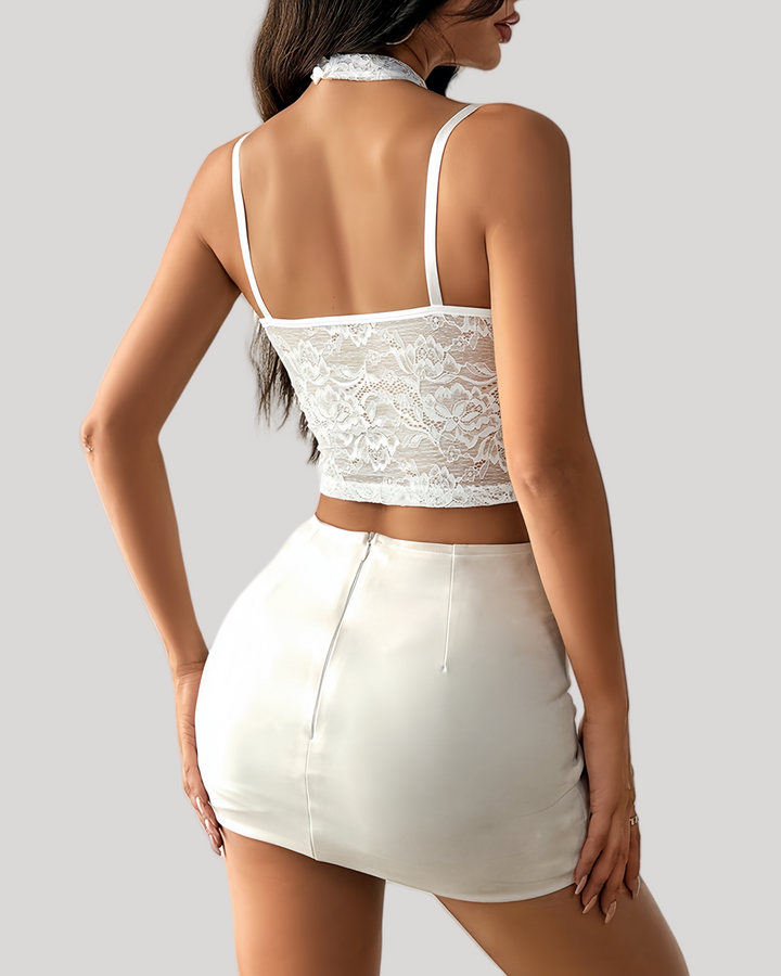 Back view of white lace bustier with adjustable straps and sheer bodice