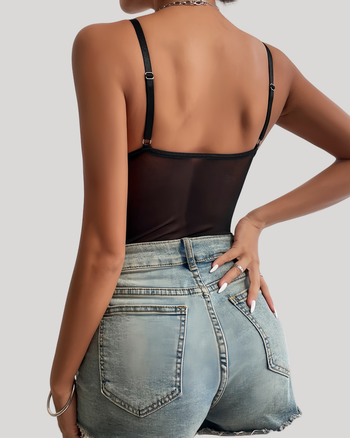 Close-up of black underwire cups and boned lace torso detail