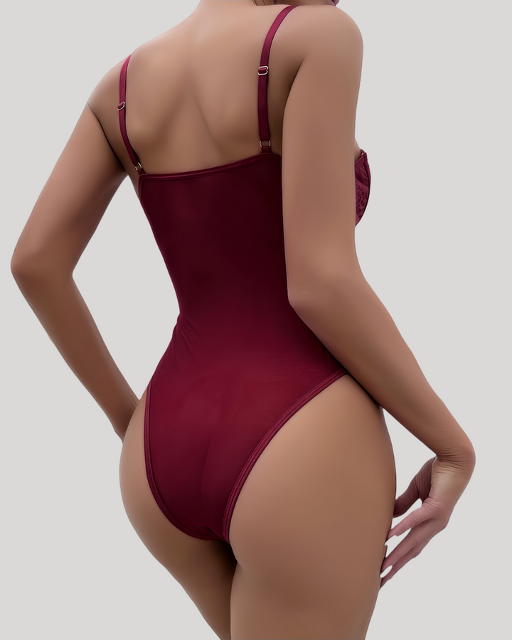 White lace corset bodysuit on model, back view against white wall
