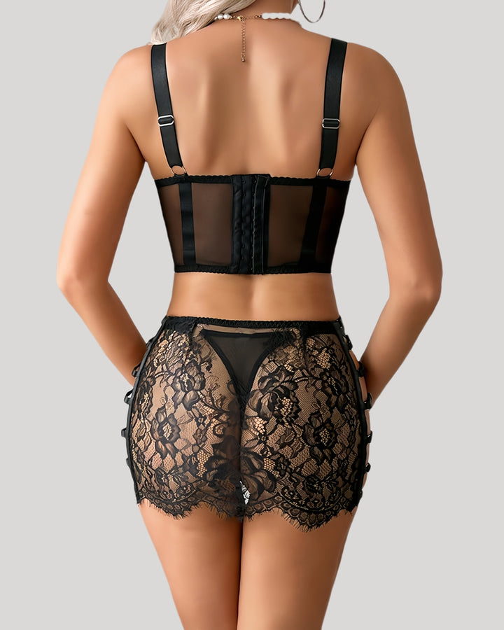 Back view showing hook closure and sheer lace back skirt in black