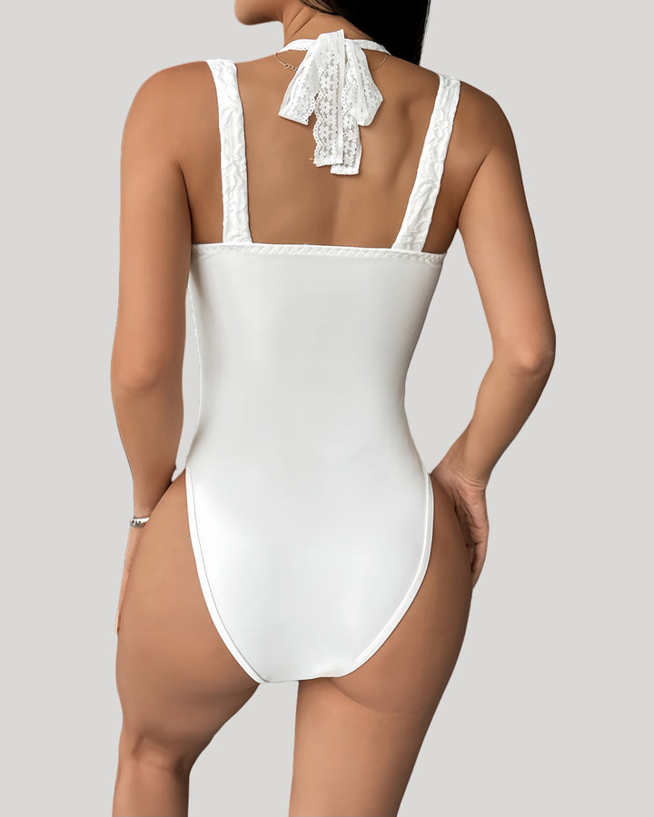 Back view of bodysuit with ribbon-tie halter and solid back panel