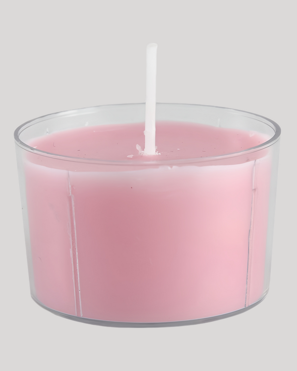 Pink low-temperature sensual play candle in a clear cup