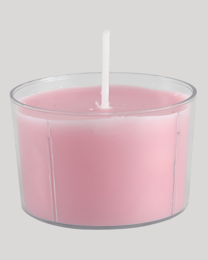 Pink low-temperature sensual play candle in a clear cup