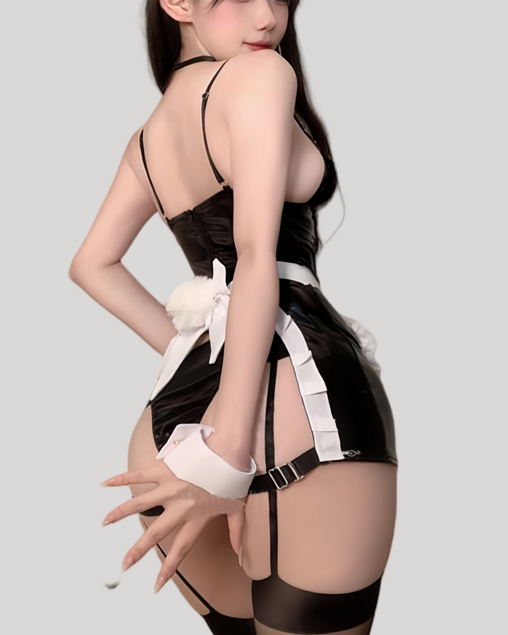 Side/back view showing open-back skirt detail and bow tie sash.