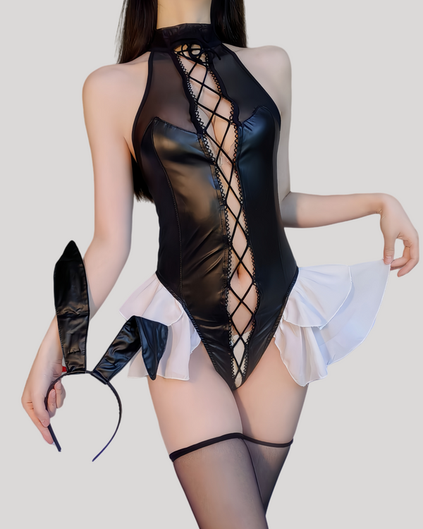 Model wearing black lace-up bunny costume bodysuit with ruffle skirt